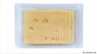 Sliced cheese with the text 'der Käse'